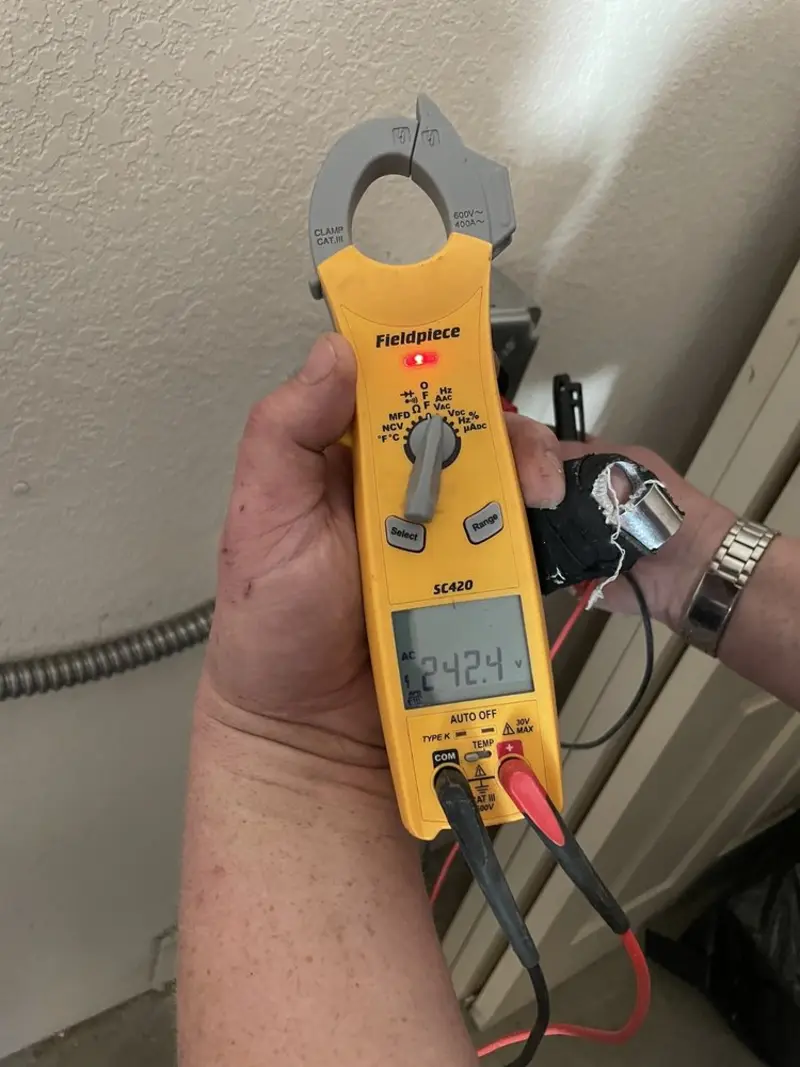 Voltage testing with clamp meter during Outlet Installation in Seminole